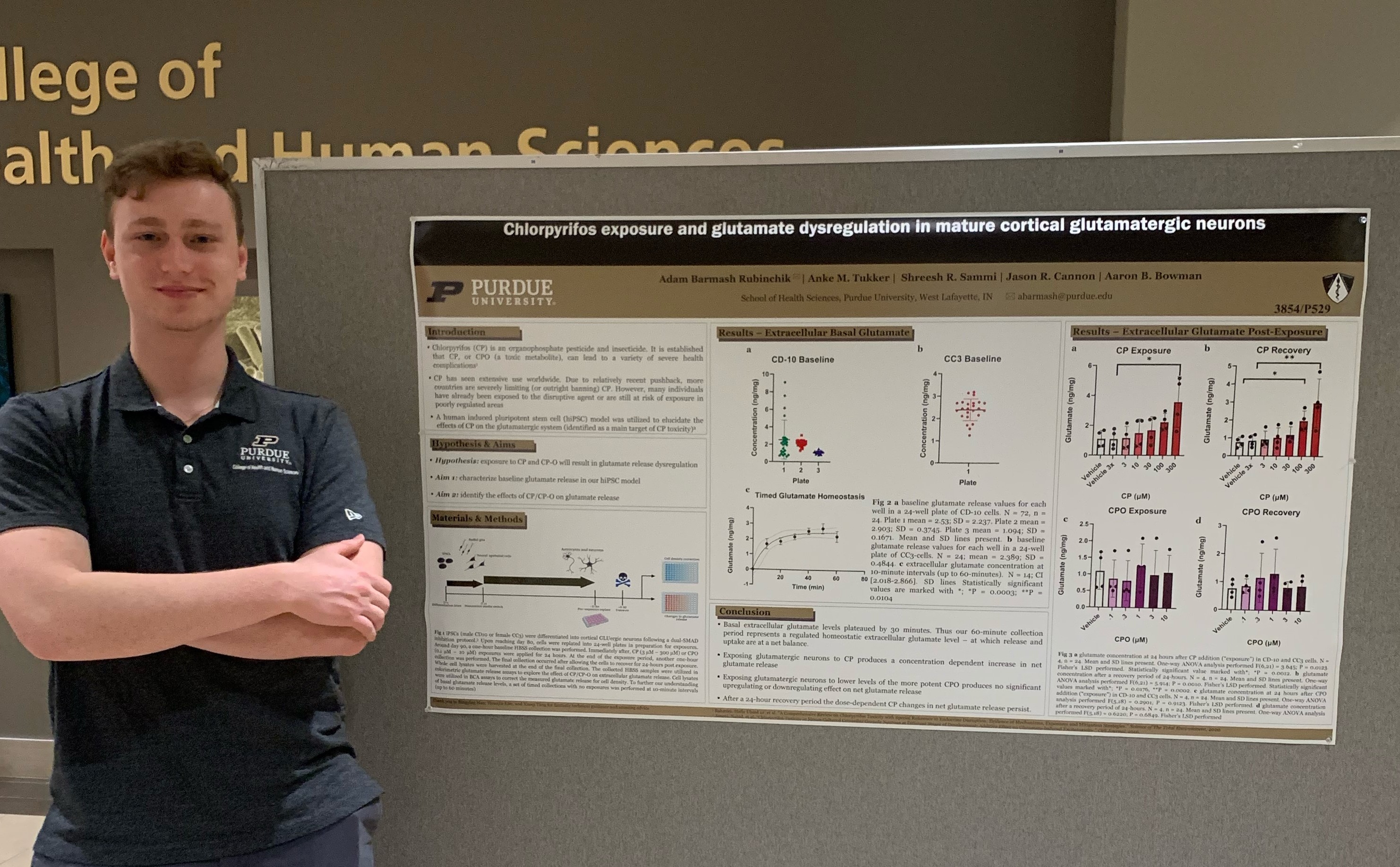 Photo of Adam Barmash with his poster he presented.