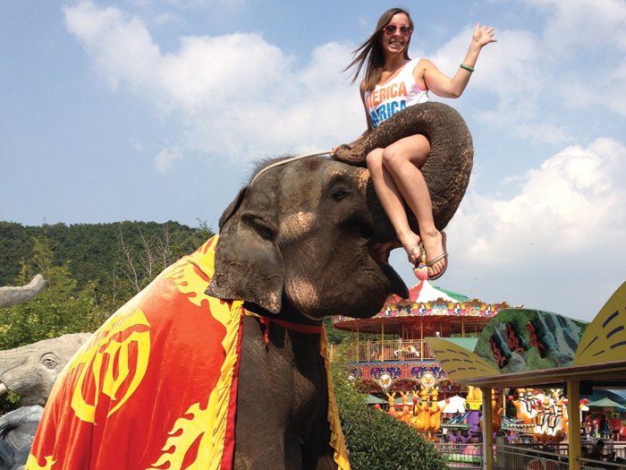 Student, Tricia Adreani, rides elephant during HTM Study Abroad trip in China
