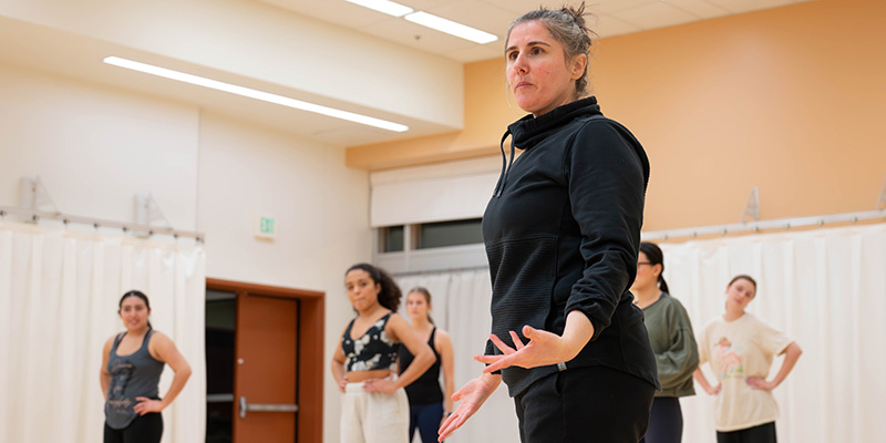 Dance instructor teaching students during practice