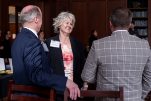 Bret Marsh, Christina Wilson-Frank and speaker J. T. Eagan having a conversation