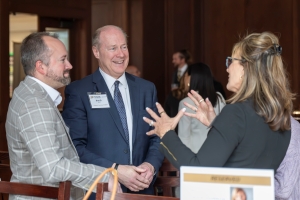 Bret Marsh, Alice Johnson, and J.T. Eagan casually converse