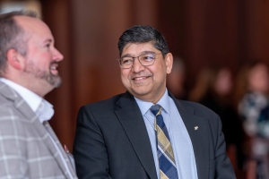 Speaker J.T. Eagan and Vice Provost for Faculty Affairs are having a nice conversation
