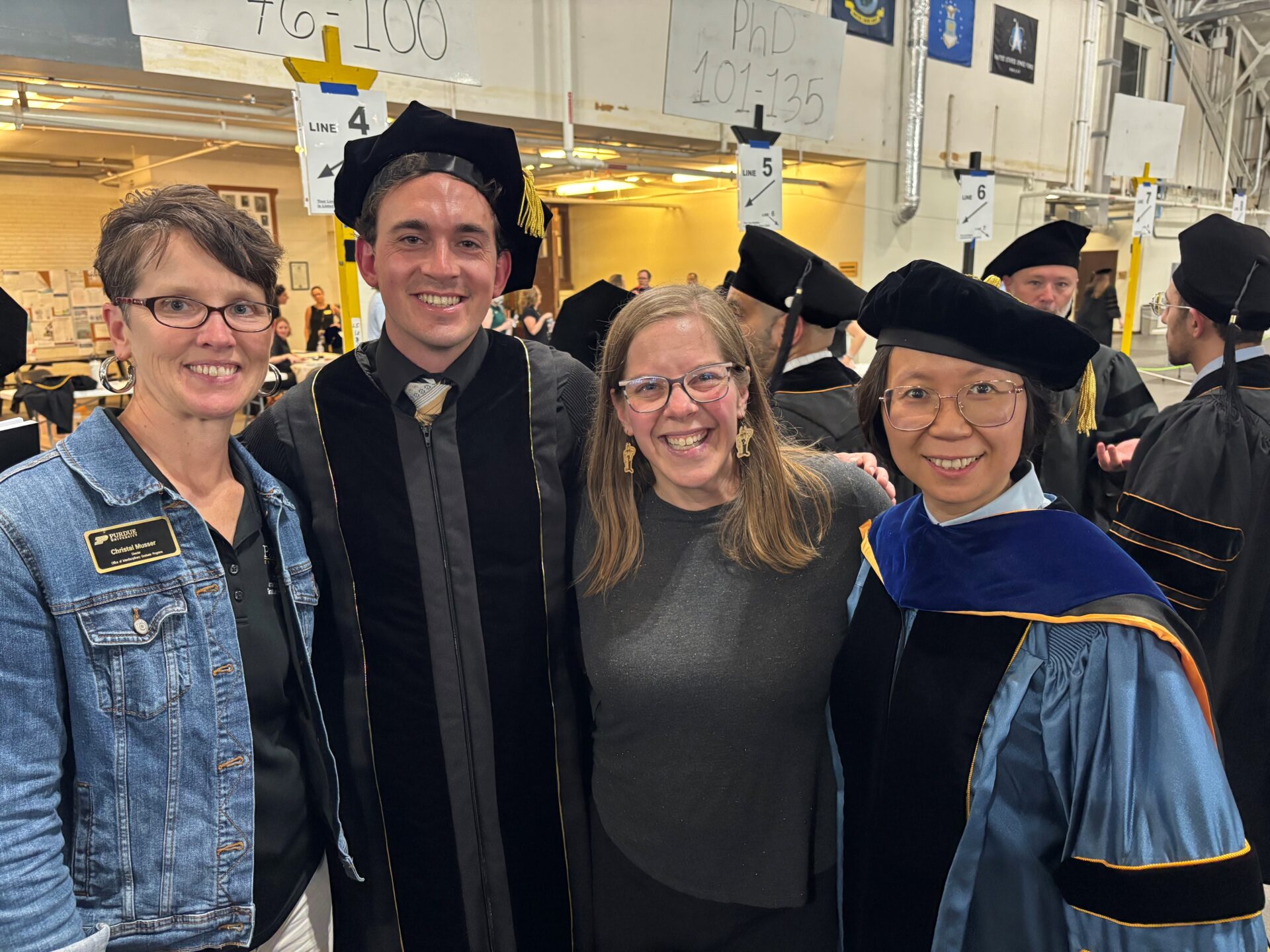 Graduate, faculty and two staff members