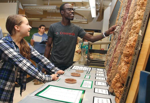Two students and soil samples
