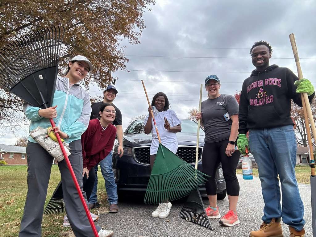 6 people with rakes