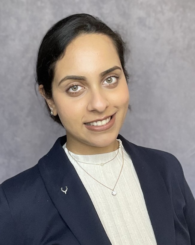 Professional headshot of a person smiling confidently