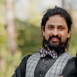 Professional headshot of a person smiling confidently