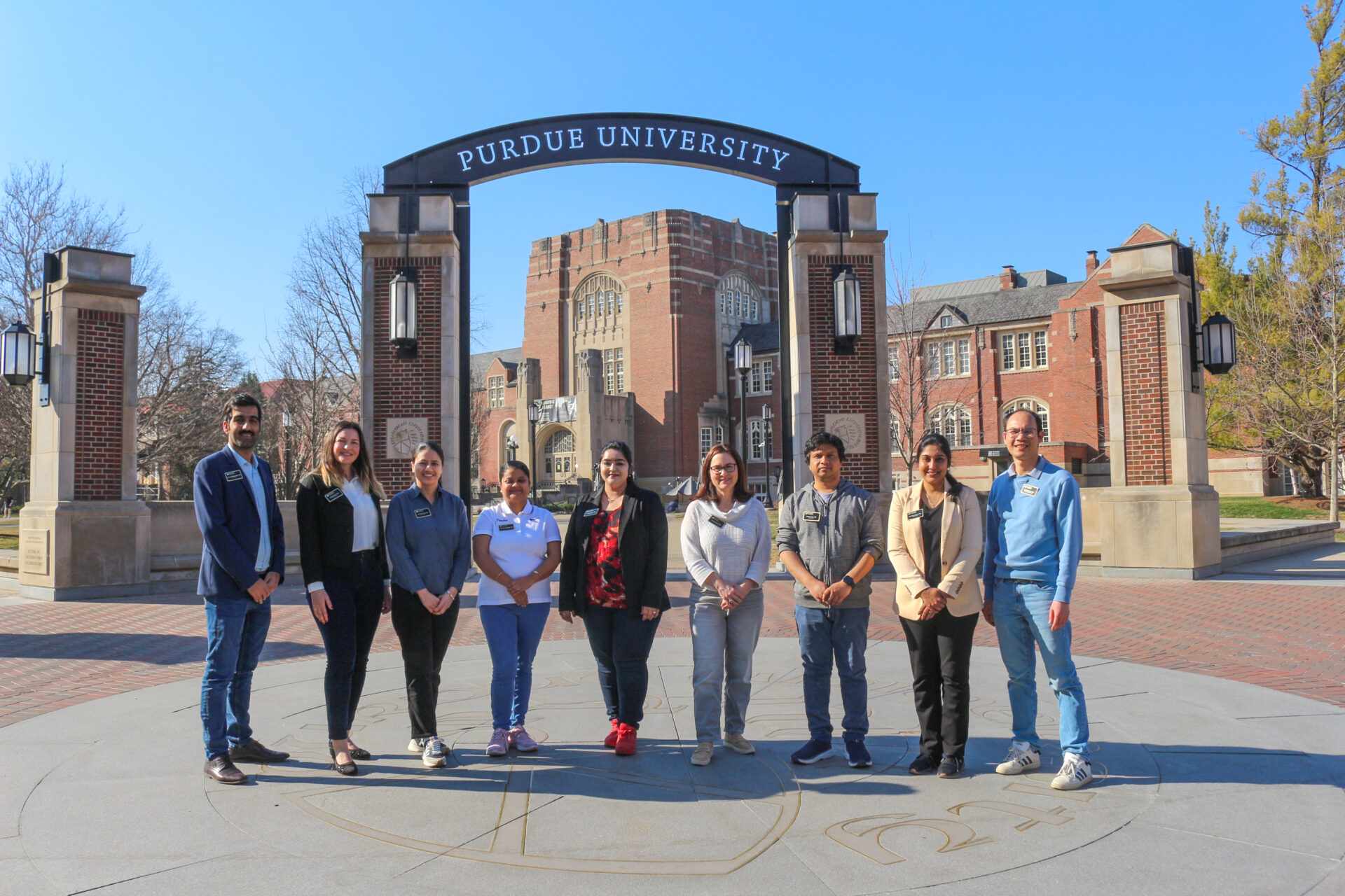 PPDA Council members standing in front of the Purdue South Archway near Purdue Memorial Union.