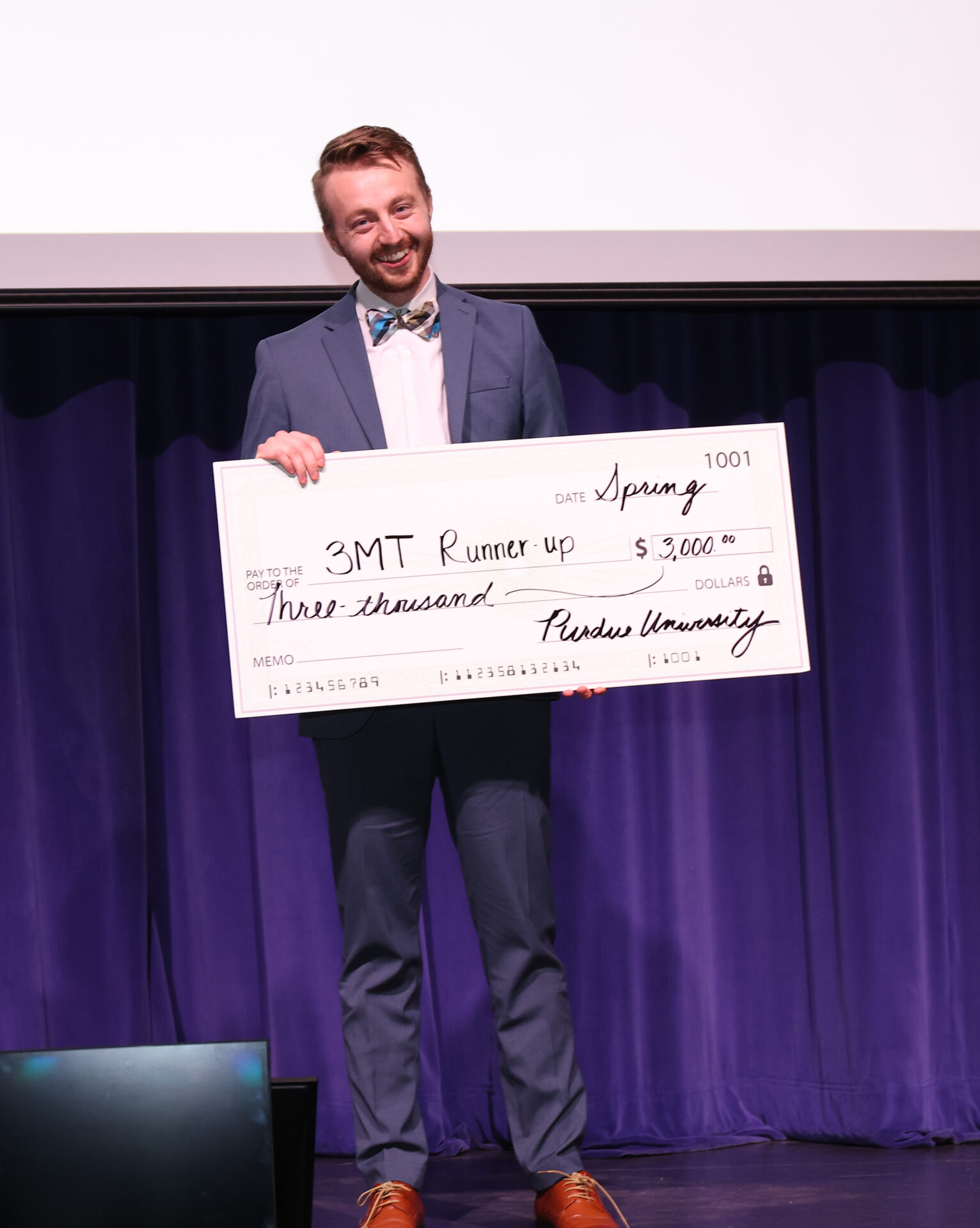 Man holding big check