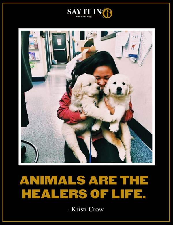 Woman on her knees holding two puppies with the caption, "Animals are the healers of life."