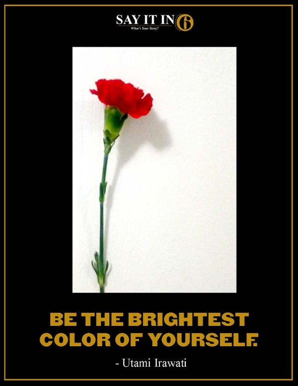 Red carnation flower on a white background with the caption, Be the brightest color of yourself.