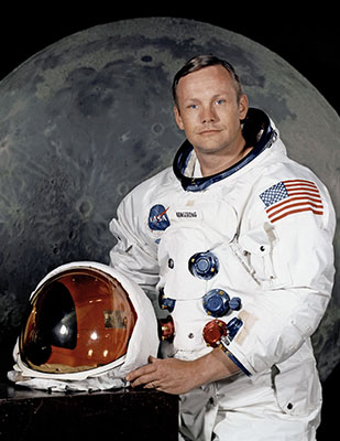 Neil Armstrong in space suit holding helmet