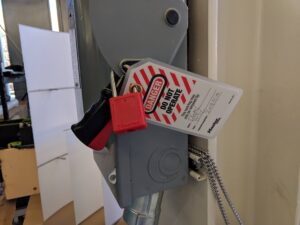 Lockout tag applied to electrical box with completed tag