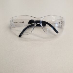 Photo of Z87+ safety glasses folded on a table.