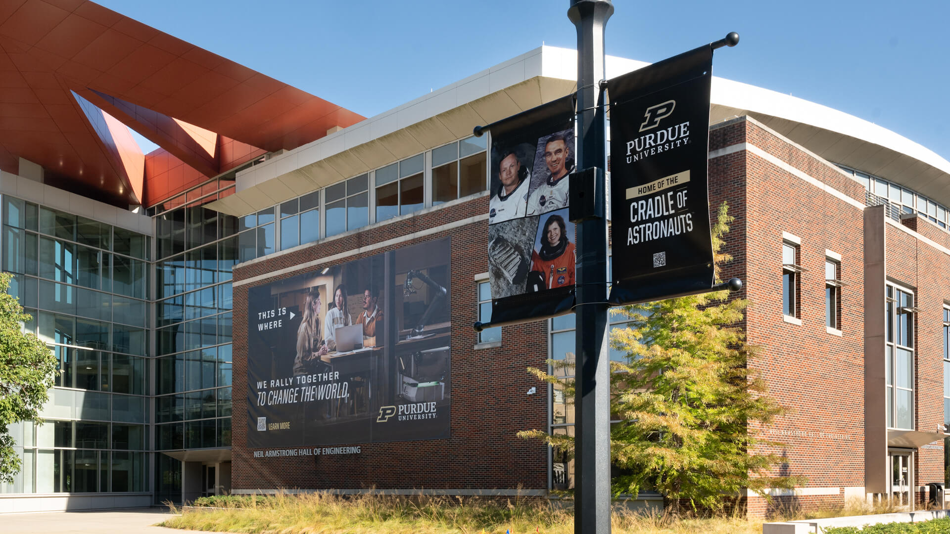 Campus building decorated with Purdue branded posters