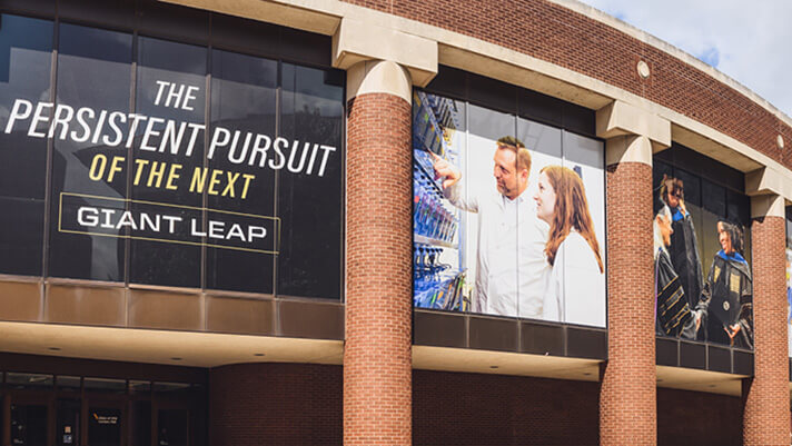 Banner on side of building containing the words