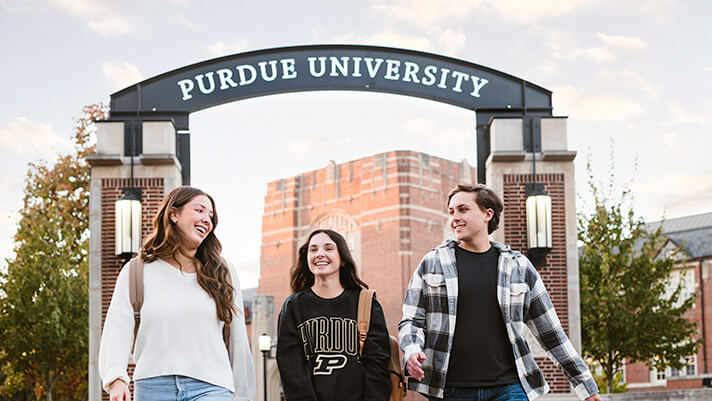 Students walking under the arch on the Purdue University campus in West Lafayette, Indiana.