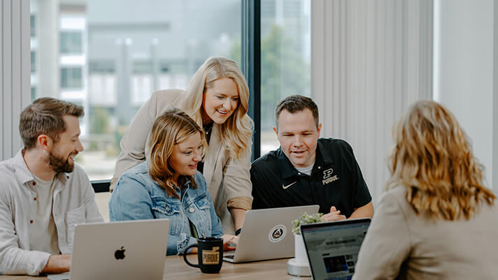 Purdue Brand Studio team members working on a project.
