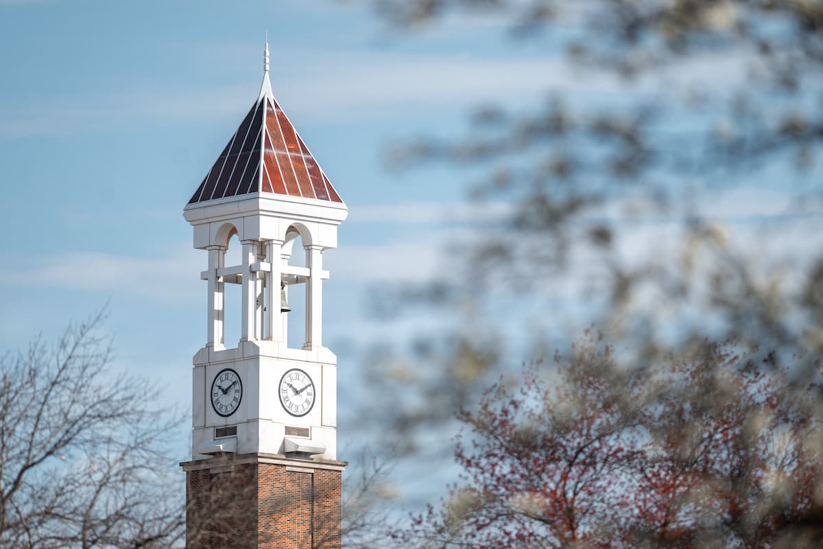 Purdue University Bell Tower against a blue sky.