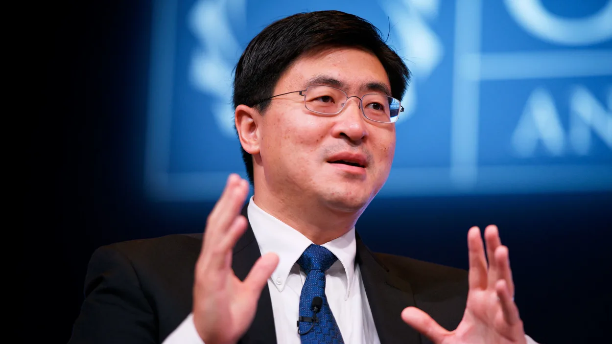 Mung Chiang speaking at a podium.