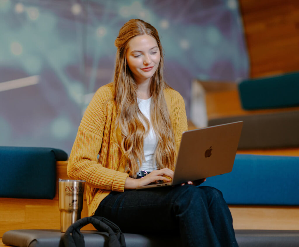 Student working on laptop.