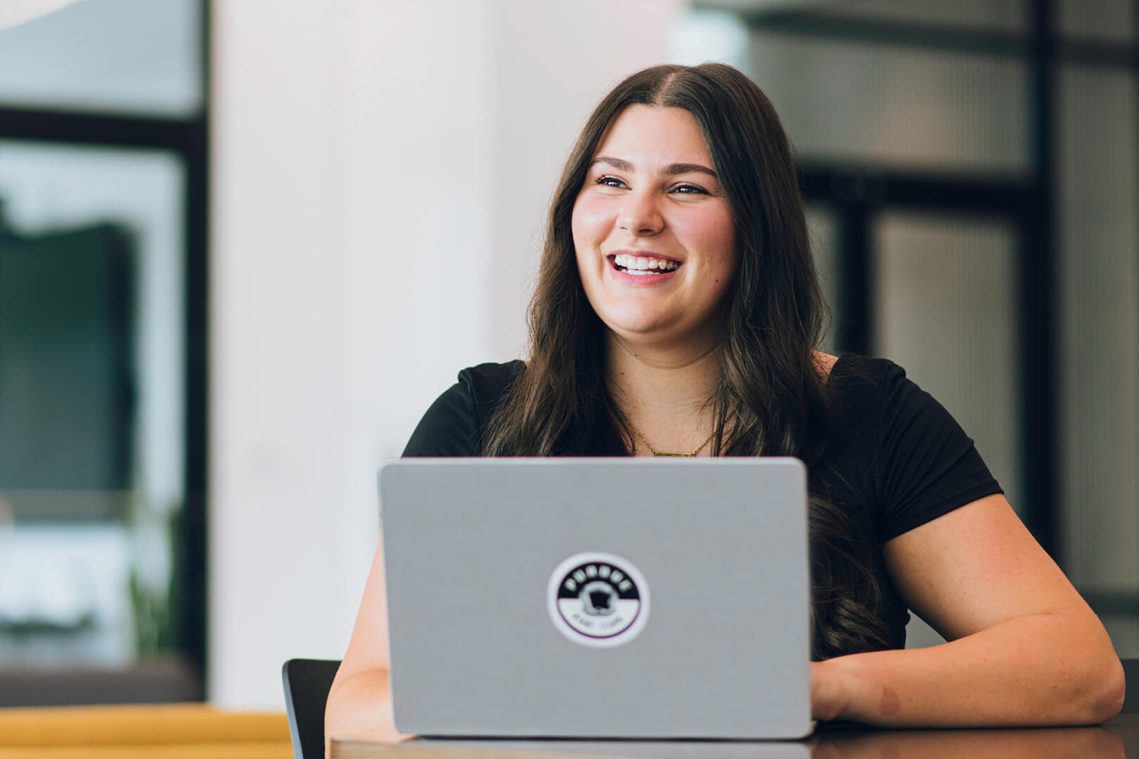 Student working on laptop.