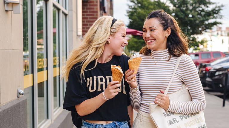 Purdue University in Indianapolis students walking and enjoying ice cream.