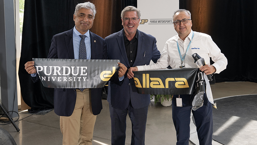 3 males at ribbon cutting