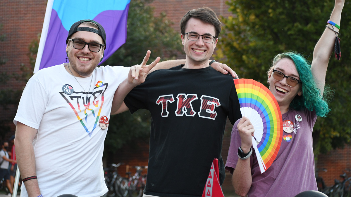 LGBTQA+ students pose for the camera.