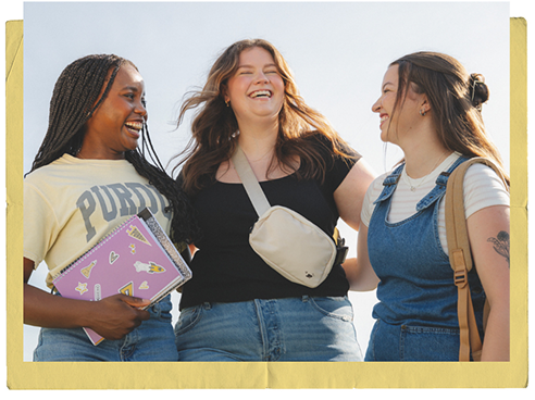 three purdue female students talking and laughing together
