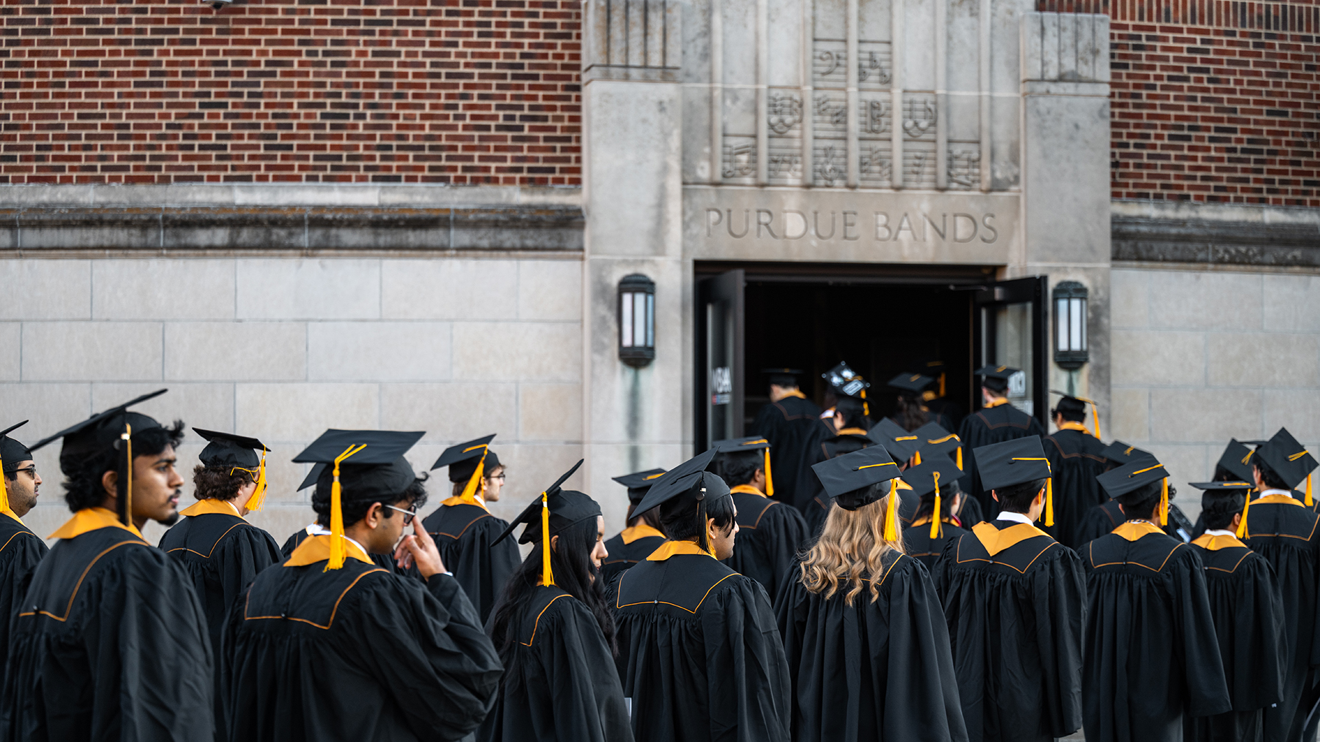 Graduates entering Elliott Hall of Music for commencement