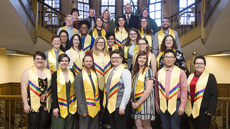 Purdue students participating in Lavender Graduation pose for a photo in Purdue Memorial Union