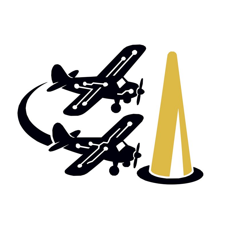 Four people standing next to a large fixed-wing drone inside a large interior space.