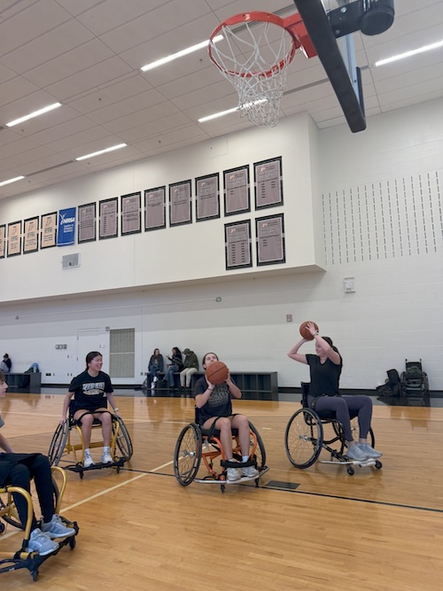 Students attend a Reinventing the Interface of Inclusivity, Sports, and Engineering (RIISE) wheelchair basketball clinic during Disability Awareness Month.