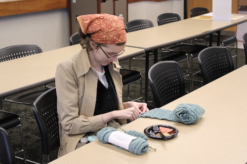 A student participates in a DRC crafting event during Disability Awareness Month. 