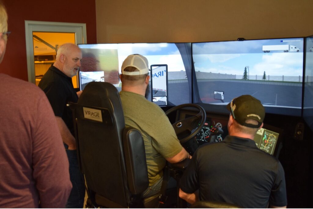 Rich Domonkos, LTAP’s Associate Director, instructs locals using LTAP’s simulator on safe driving practices.