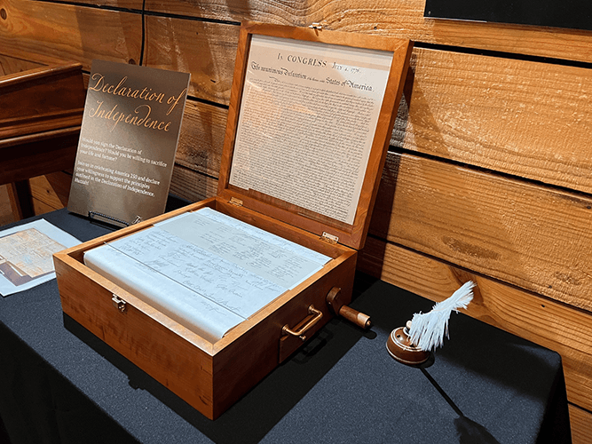 The interactive Declaration exhibit in its handcrafted Indiana cherry wood display, with a replica of the Declaration of Independence inside the lid