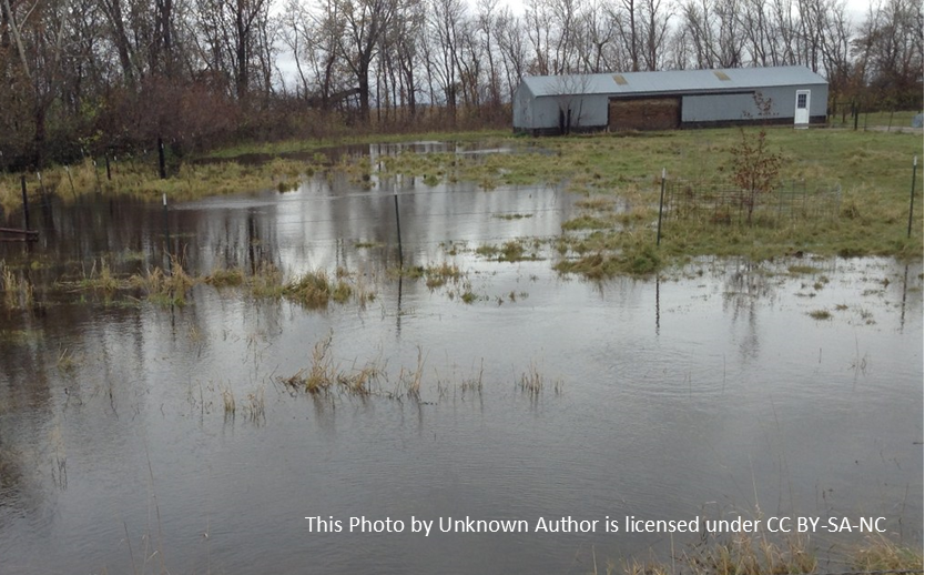 Picture of pole barn and flooded barnlot