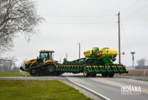 tractor pulling planter turning off road