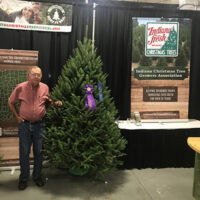 Image of Dan with the grand champion tree