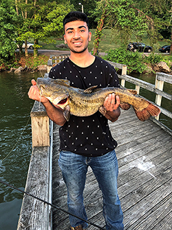 Rajeev Kumar holding a fish