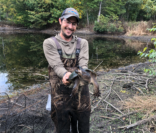 Tyler Hoskins holding turtle
