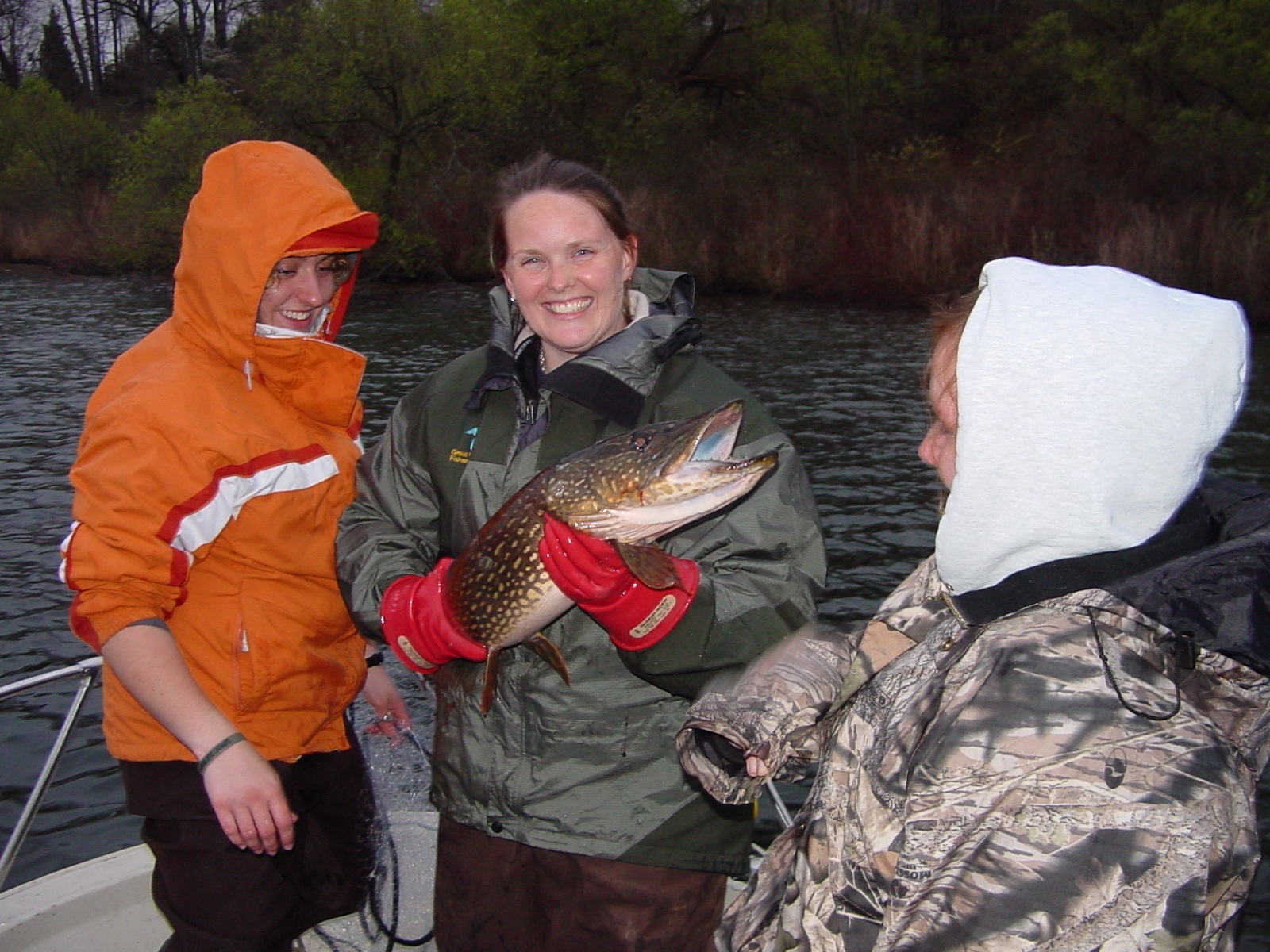 Team members holding a fish