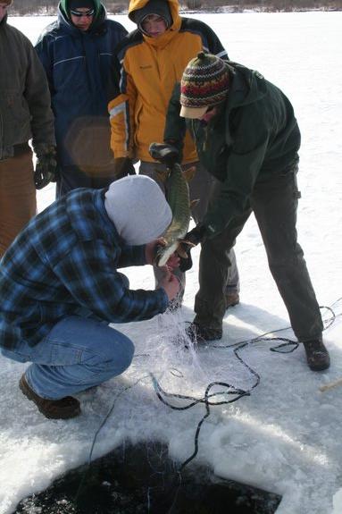 Team members ice fishing
