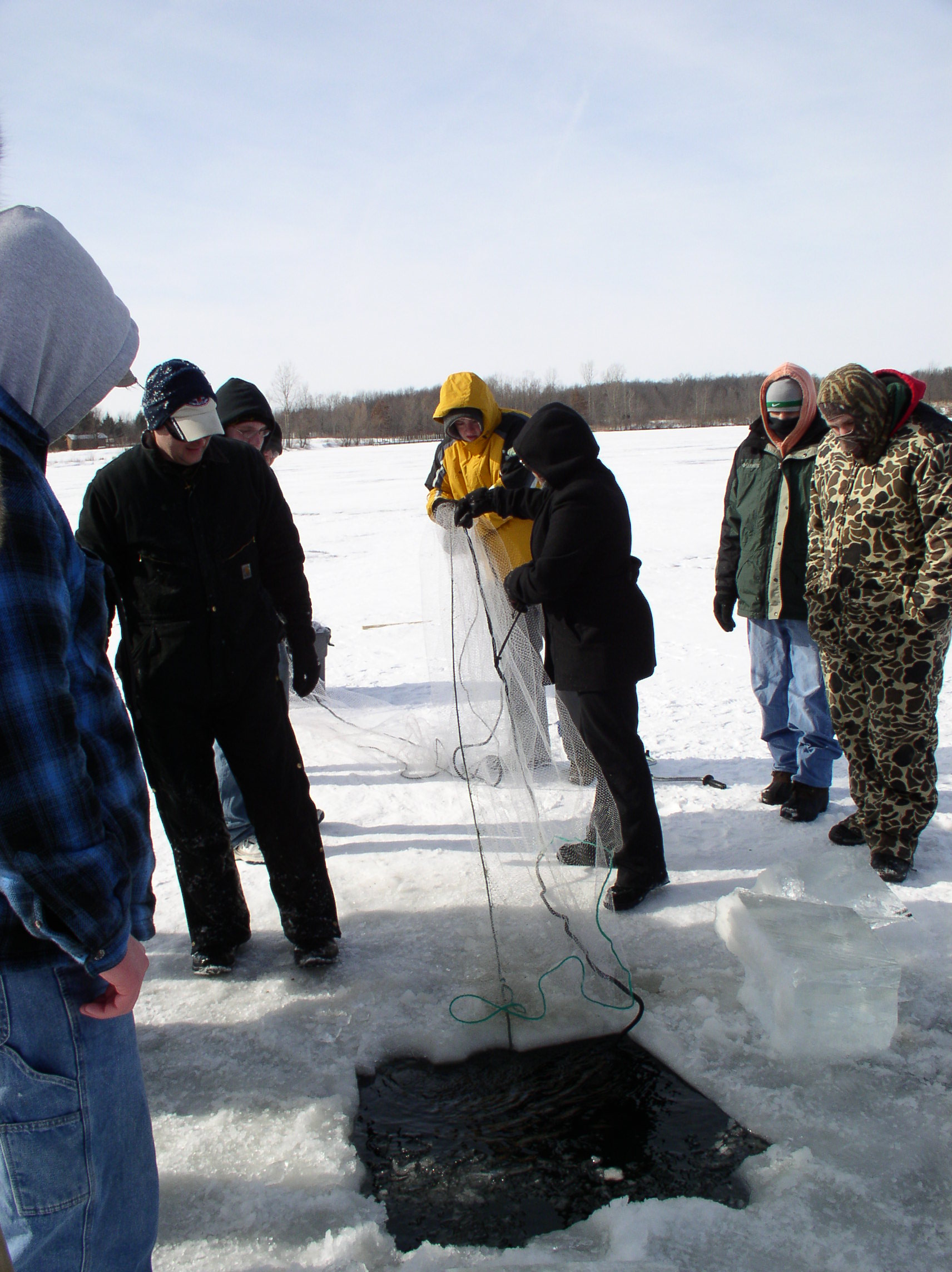 Team members ice fishing