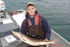 Brandon Sturgeon holding a fish