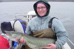 Team member holding a fish