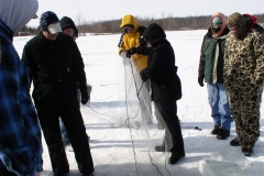 Team members ice fishing