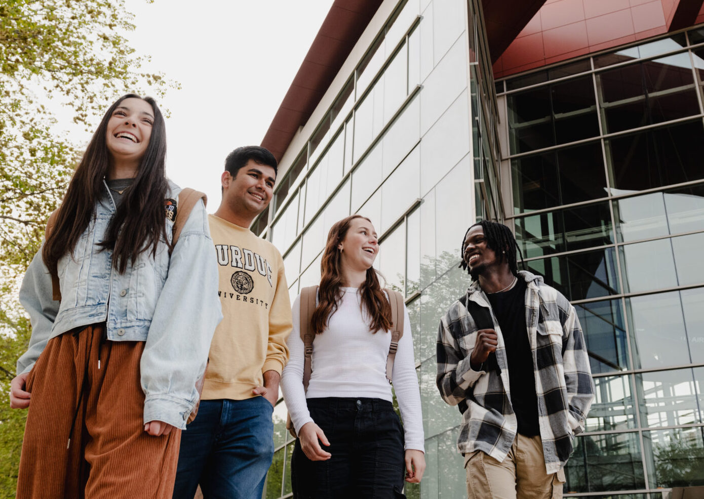 Purdue Engineering students walking next to Armstrong Hall