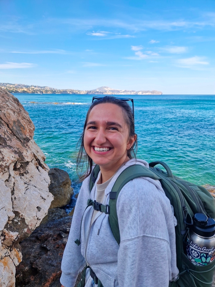 Yagmur Onder poses in front of the sea